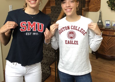 Two women recruiting for SMU College Eagles wearing t-shirts.