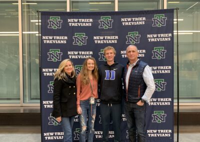 A group of people standing in front of a new york trevians sign.
