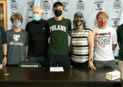 A group of people standing around a table.